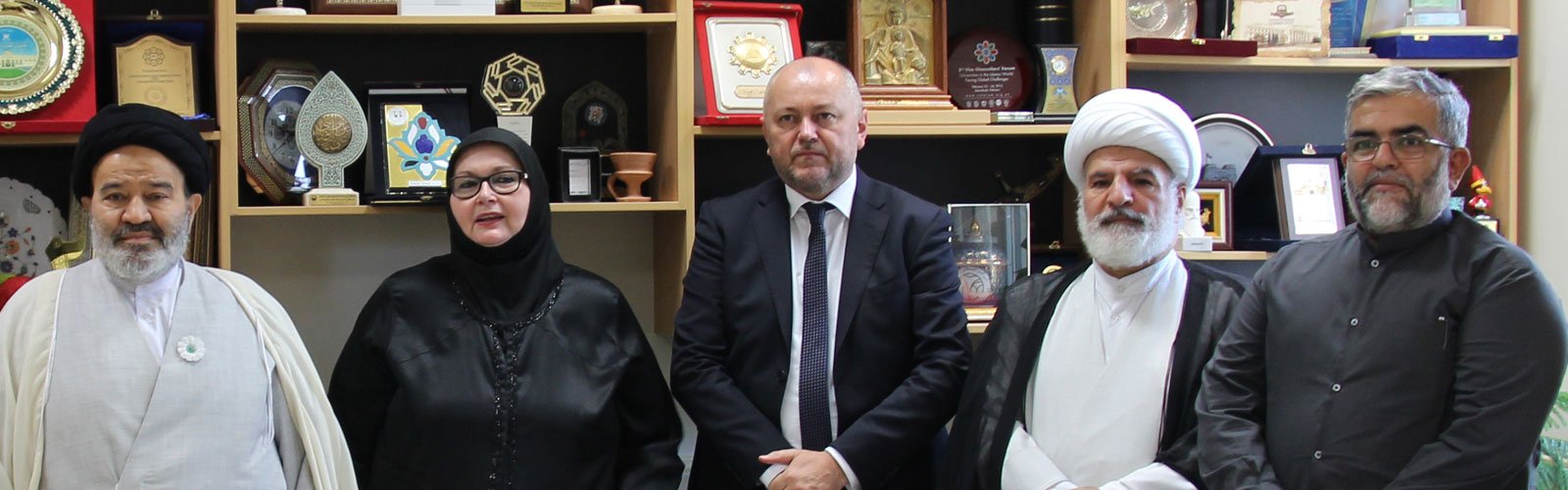 Foreign minister of Bosnia and Herzegovina, Bisera Turković, met with Hujjat al-Islam Sayed Abulhasan Navab at the University of Religions and Denominations on Friday, August 6, 2021. According to the Public Relations Office of the university, Foreign Minister Bisera Turković, the Chairman of the Council of Ministers, and the Vice Prime Minister met with Hujjat al-Islam Sayed Abulhasan Navab, the President of the University of Religions and Denominations. They were welcomed by Hujjat al-Islam Navab: “I am honored to recognize myself as a citizen of Bosnia. I have travelled to Bosnia and Herzegovina more than 50 times, and have done whatever I could for Bosnia and Herzegovina. Bosnia is in our heart. During the conflicts in Bosnia, I got about to martyrdom while visiting the battlefields. I was also in contact with the foreign minister and the defense minister, the late Mr. Rizvan. They were martyred, but I did not have the honor [to be martyred]”. While referring to the academic characteristics of the foreign minister of Bosnia, he continued: today is a historical and memorable day for the University of Religions and Denominations. In fact, hosting any Bosnian figure at our university would be an honor for us. I feel that your presence here is a great opportunity for us and for the people of Bosnia. He later introduced the University of Religions and Denominations as an international university and indicated: this is the only university of religions and denominations in the world. In view of this university, the interfaith dialogue is an essential matter in today’s human life. Great people such as Professor Hamid Algar have also acknowledged this fact. The University of Religions and Denominations is an honor to the Seminary and Iran. Three quarters of our students are international students from 40 countries, and this number is increasing. The University of Religions and Denominations has 14 faculties. Expressing happiness being at the University of Religions and Denominations, Ms. Turković also mentioned: I deeply believe that without Iran’s presence in Bosnia in the most difficult situations, Bosnia would have never been in today’s conditions. The support of the Iranian people has been invaluable. Turković further commemorated the martyrs in Bosnia war and said: with great sadness, we honor the memory of the Iranian martyrs in Bosnia, whose blood along with the blood of Bosnian martyrs, deepened these relations and strengthened the foundation of the newly established country of Bosnia. Bosnia will never be able to compensate or pay for the Iranian martyrs, whose blood saved the people and country of Bosnia. During the war in Bosnia, I was in Croatia as the first ambassador on behalf of Ali Ezzat Begović and witnessed Iran's aid to Bosnia. I affirm your words regarding the important and sacred goals in establishing this great university and the importance of interfaith dialogue. To me, the interfaith dialogue is the most important matter in today’s world. In addition to Bisera Turković, other figures were also present in this meeting including the ambassador of the Republic of Bosnia, the president of Iran-and-Bosnia Friendship Association, and a number of university authorities. At the end of the meeting, President Hujjat al-Islam Navab presented the special plaque of the university to Ms. Turković, while wearing the remembrance poppy pin for the Bosnian martyrs woven by the martyrs’ mothers. This remembrance symbol is considered as the most important symbol in Bosnia.